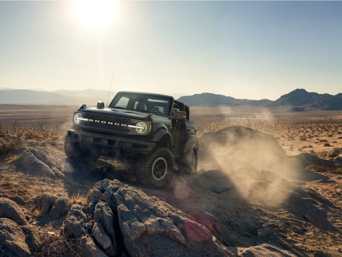 2024 Ford Bronco off-roading on a rocky hill