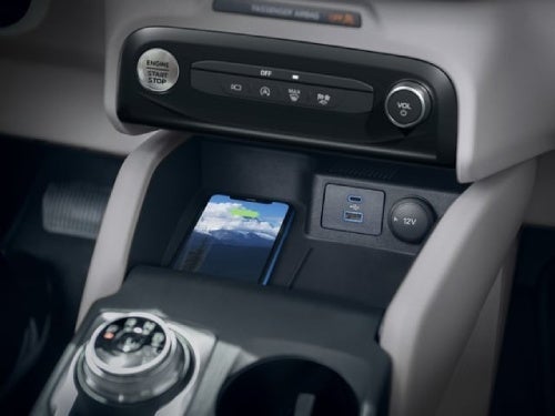 2024 Ford Escape Plug-in Hybrid close up view of phone on wireless charger