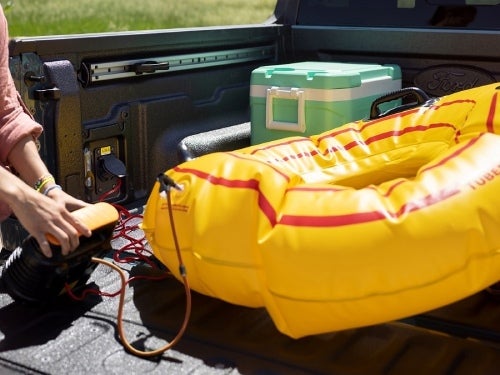 2024 Ford Maverick view of person using 110v outlet to blow up a raft