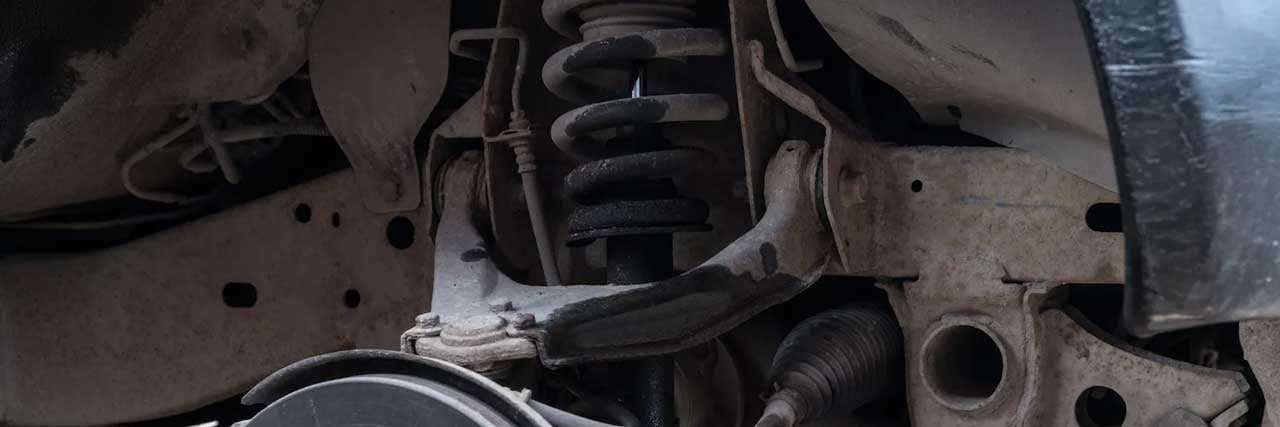 Close up view of a car's shocks and struts